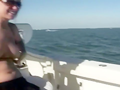 2 cuties flash their tits on a boat