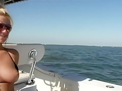 2 cuties flash their tits on a boat