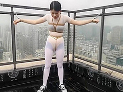 Asian Girl Cuffed On The Roof