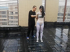 Asian Girl Cuffed On The Roof