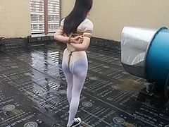 Asian Girl Cuffed On The Roof