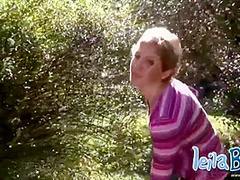 Busty MILF strips off outdoors