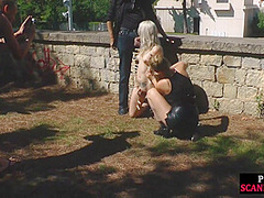 Public bdsm sub dominated outdoors before dick sucking