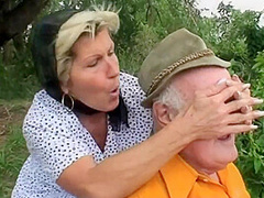 A Blond Girl Washes Herself By The River And Two Old Men See