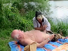 A Blond Girl Washes Herself By The River And Two Old Men See