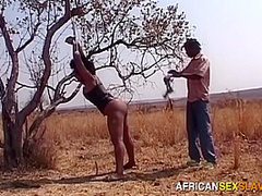 Naughty african woman outdoor BDSM public whipping for stealing