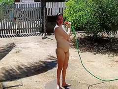 Nudist Housewife Taking Bath In Front Yard