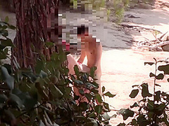 Couple Threesome In A Nudist Beach