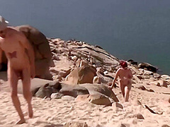 Couple Threesome In A Nudist Beach