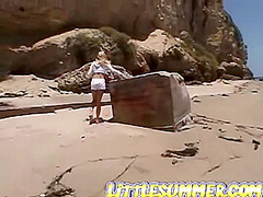 Teen lesbo fingered on the beach