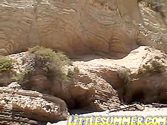 Teen lesbo fingered on the beach