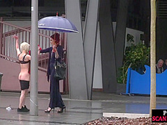 Lezdom redhead MILF shows teen bondservant outdoor in public
