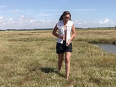 Sexy Girl Playing In The River Mud. Muddy Fun (fully Clothed)