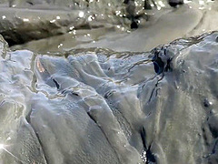 Sexy Girl Playing In The River Mud. Muddy Fun (fully Clothed)