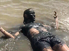 Sexy Girl Playing In The River Mud. Muddy Fun (fully Clothed)