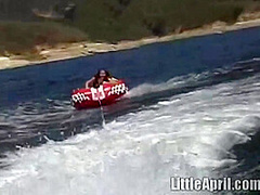 Sexy teen Little April playing with her snatch outdoors in rubber boat
