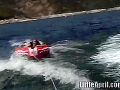 Sexy teen Little April playing with her snatch outdoors in rubber boat