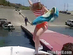 Sexy teen Little April playing with her snatch outdoors in rubber boat