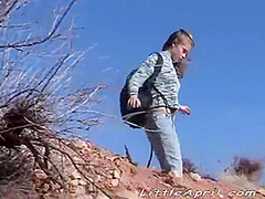 Little April goes outdoors to masturbate