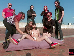 BDSM teen enjoys outdoor pussy and body torment from group
