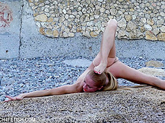 Naked And Flexible On The Beach - Watch4Fetish