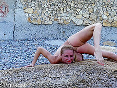 Naked And Flexible On The Beach - Watch4Fetish