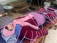 Wool Mohair Layers Of Sweaters On A Bondage Table