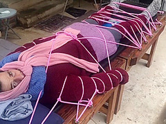 Wool Mohair Layers Of Sweaters On A Bondage Table
