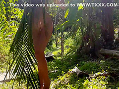 A Naked Girl Is Photographed In The Wild Jungle Of