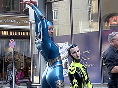 Through The City In A Tight Latex Costume - Watch4Fetish