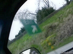Hot Babe rubbing a cock while the guy driving caught on tape
