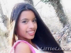 Petite latina masturbates under the sun