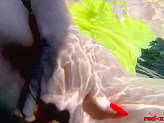 Red XXX fucks her pussy with a toy in the pool