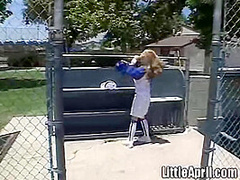 Little April rubs her pussy after baseball