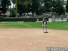 Little April rubs her pussy after baseball