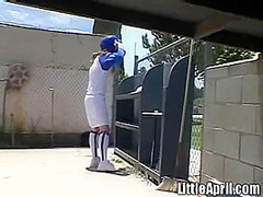 Little April rubs her pussy after baseball