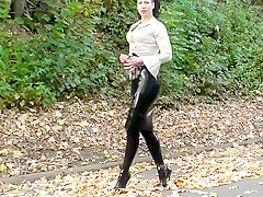 Lady black latex skirt outdoor