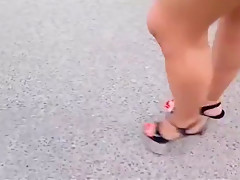 Walking with extreme plateau high heels