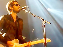 Audience girl strips on stage during a concert