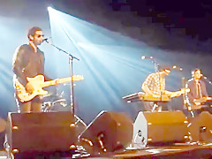 Audience girl strips on stage during a concert