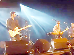 Audience girl strips on stage during a concert