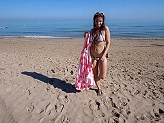 Bikini Fanatic enjoys herself on the beach!