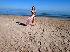 Bikini Fanatic enjoys herself on the beach!