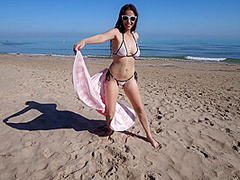 Bikini Fanatic enjoys herself on the beach!