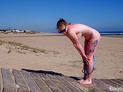 Pale redhead bikini amateur in a sling