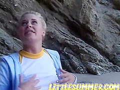 Solo teen fingering her pussy outdoors