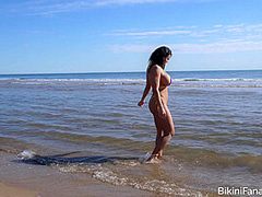 Busty bikini model loves the beach