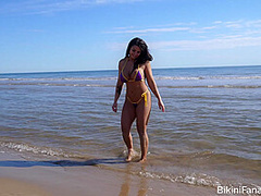 Busty bikini model loves the beach