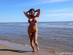 Busty bikini model loves the beach