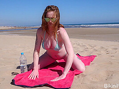 Sheer wet bikini on a public beach